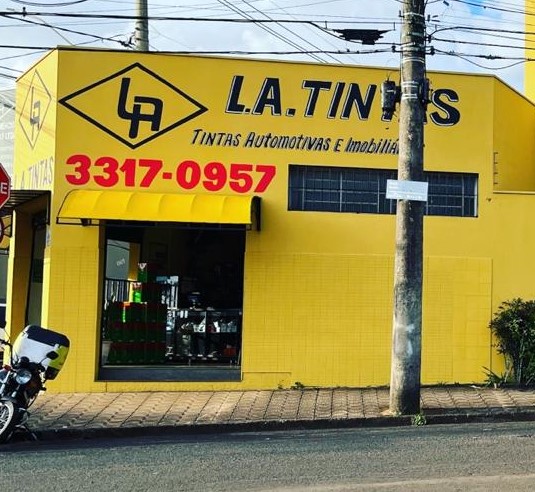 Young happy couple choosing in what color painting their new house